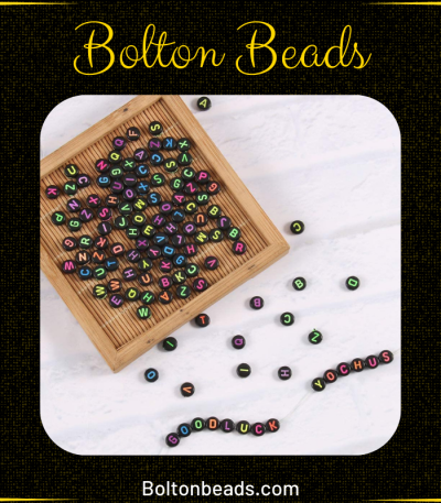 Close-up of Alphabet Beads in Black Neon (Round) 7mm for jewelry making.